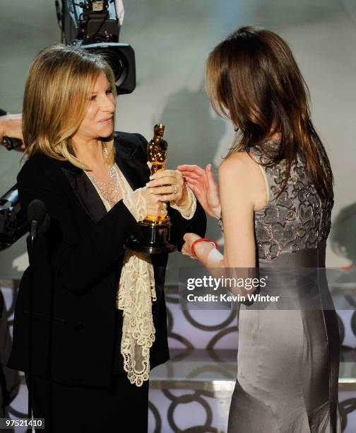 Director Kathryn Bigelow accepts Best Director award for "The Hurt Locker" from presenter Barbra Streisand onstage during the 82nd Annual Academy...