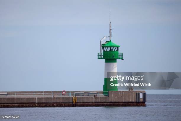 lighthouse at nordermole, travemuende, luebeck, schleswig-holstein, germany - travemuende stock pictures, royalty-free photos & images