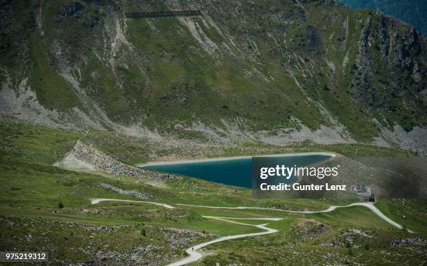 reservoir in the shape of a heart, goldried, high tauern national park, matrei, east tyrol, tyrol, austria - osttirol stock pictures, royalty-free photos & images