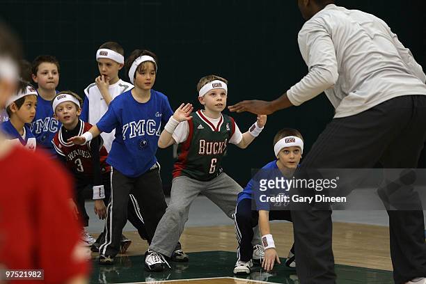Luc Richard Mbah a Moute of the Milwaukee Bucks demonstrates defensive skills during the annual YMCA basketball clinic on March 7, 2010 at The Bucks...