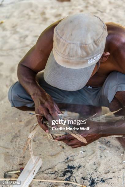 man of the orang asil starting a fire, taman negara, malaysia - taman negara national park stock pictures, royalty-free photos & images