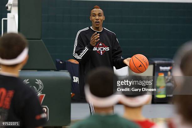 Brandon Jennings of the Milwaukee Bucks participates in the annual YMCA basketball clinic on March 7, 2010 at The Bucks Training Center in Milwaukee,...