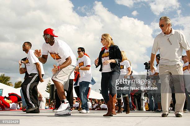 Dwyane Wade and Heat President Pat Riley participate in the 13th Annual Family Festival on March 7, 2010 at Watson Island in Miami, Florida. NOTE TO...