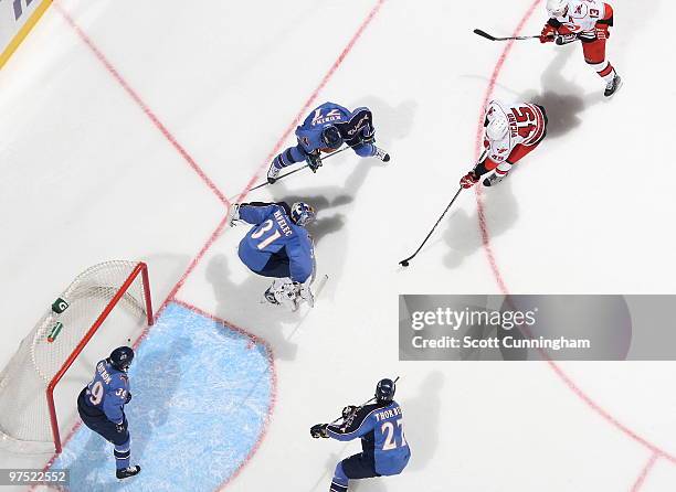 Alexandre Picard of the Carolina Hurricanes drives to the net against Ondrej Pavelec of the Atlanta Thrashers at Philips Arena on March 7, 2010 in...