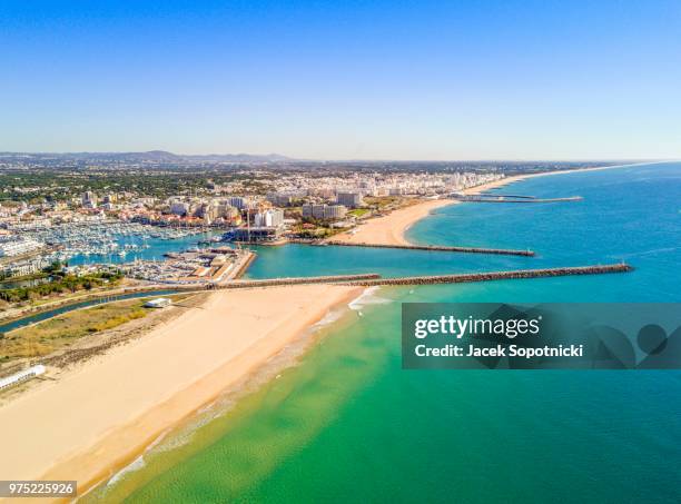 aerial view marina and wide sandy beach, vilamoura, algarve, portugal - vilamoura stock pictures, royalty-free photos & images