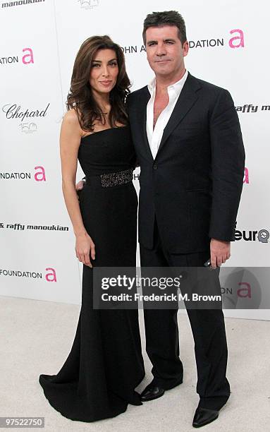 Simon Cowell and makeup artist Mezhgan Hussainy arrive at the 18th annual Elton John AIDS Foundation's Oscar Viewing Party held at the Pacific Design...