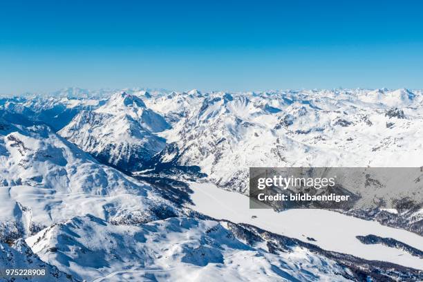 view of lake sils from corvatsch, mountains in winter, swiss alps, engadin, canton of graubuenden, switzerland - graubunden canton fotografías e imágenes de stock