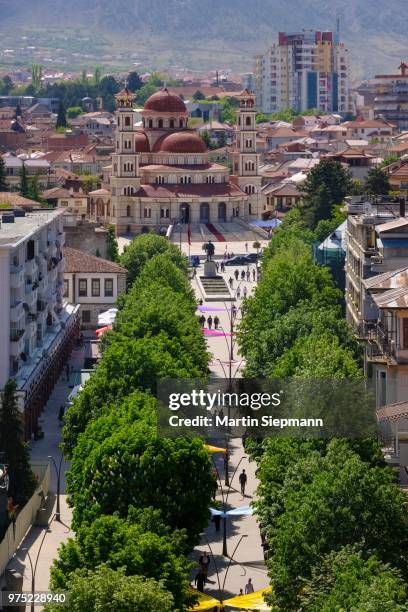 pedestrian promenade, resurrection cathedral in the back, view from red tower, city centre, korca, korca, albania - albania stock-fotos und bilder