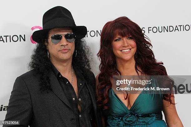 Slash and wife Perla Ferrar arrive at the 18th annual Elton John AIDS Foundation's Oscar Viewing Party held at the Pacific Design Center on March 7,...