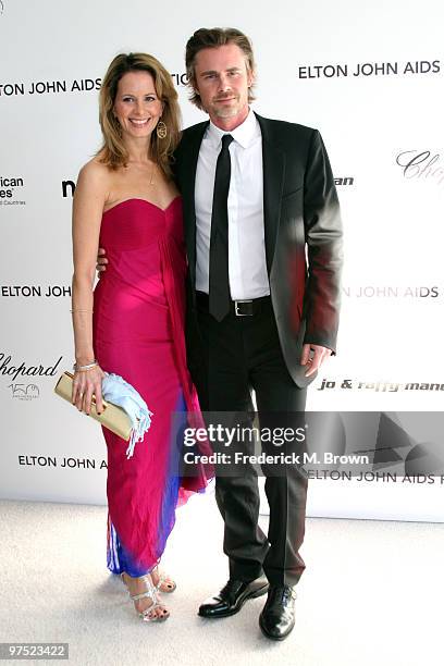 Actress Missy Yager and actor Sam Trammell arrive at the 18th annual Elton John AIDS Foundation's Oscar Viewing Party held at the Pacific Design...