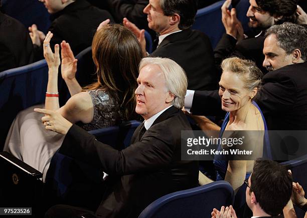 Director James Cameron and wife actress Suzy Amis applaud from the audience during the 82nd Annual Academy Awards held at Kodak Theatre on March 7,...