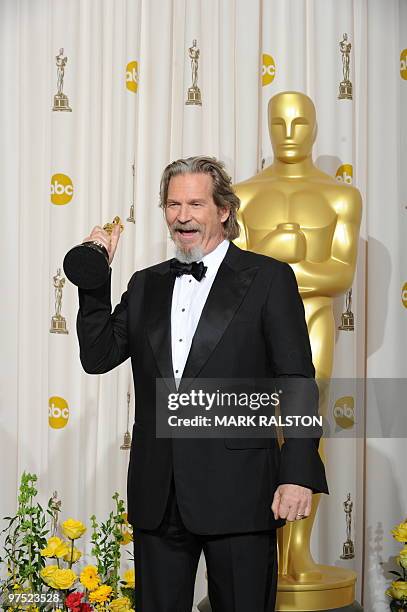 Actor Jeff Bridges celebrates his Oscar for best actor for his portrayal of an alcoholic country singer in the drama "Crazy Heart" during the 82nd...