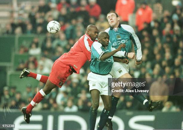 Richard Rufus of Charlton Athletic and Shaun Goater and Richard Dunne of Manchester City in action during the Premier League match between Manchester...