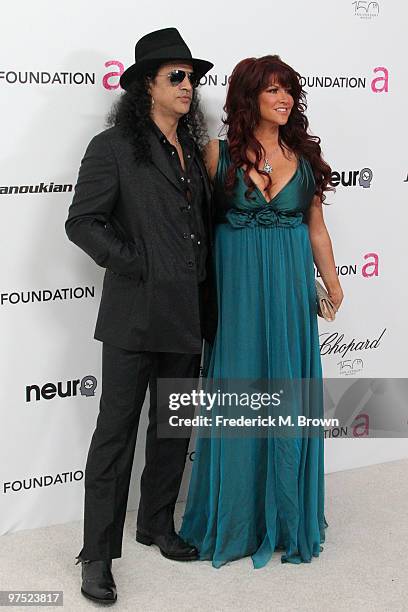 Musician Slash and his wife Perla Ferrar arrive at the 18th annual Elton John AIDS Foundation Oscar Party held at Pacific Design Center on March 7,...