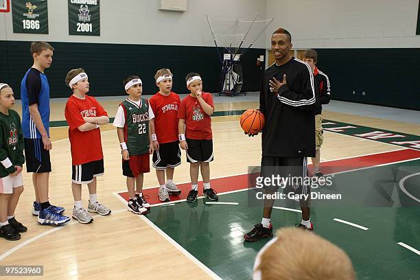 Brandon Jennings of the Milwaukee Bucks participates in the annual YMCA basketball clinic on March 7, 2010 at The Bucks Training Center in Milwaukee,...