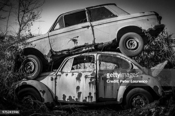stack of two car wrecks - peter lourenco stockfoto's en -beelden