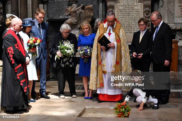 Dean of Westminster, John Hall , accompanied by first wife Jane Hawking and daughter Lucy Hawking , presides over the internment of the ashes of...