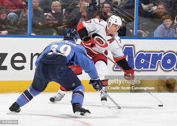 Rod Brind'Amour of the Carolina Hurricanes gets set to fire a shot against Tobias Enstrom of the Atlanta Thrashers at Philips Arena on March 7, 2010...