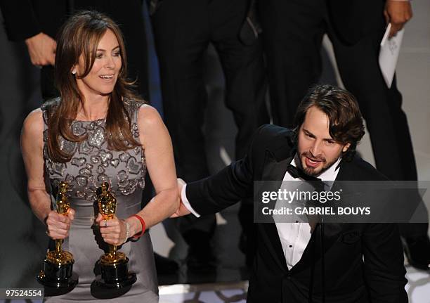 Winner for Best Director and Best Picture Kathryn Bigelow for "The Hurt Locker" poses her trophies poses with winner for Writing Mark Boal for "The...