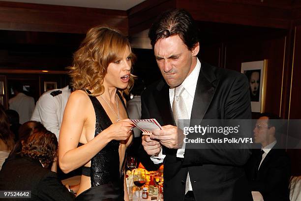 Actors Hilary Swank and Jon Hamm attends the 2010 Vanity Fair Oscar Party hosted by Graydon Carter at the Sunset Tower Hotel on March 7, 2010 in West...
