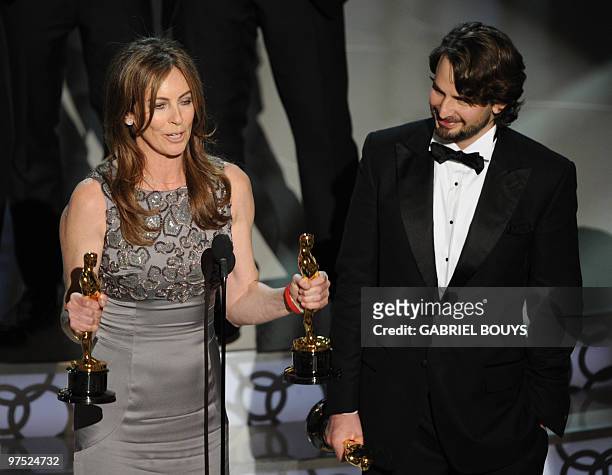 Winner for Best Director and Best Picture Kathryn Bigelow for "The Hurt Locker" poses her trophies poses with winner for Writing Mark Boal for "The...
