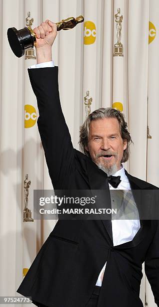Actor Jeff Bridges celebrates his Oscar for best actor for his portrayal of an alcoholic country singer in the drama "Crazy Heart" during the 82nd...