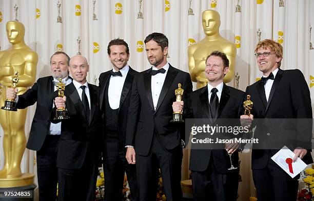 Presenters Bradley Cooper and Gerard Butler pose with Joe Letteri, Stephen Rosenbaum, Richard Baneham and Andrew Jones, winners of Best Visual...