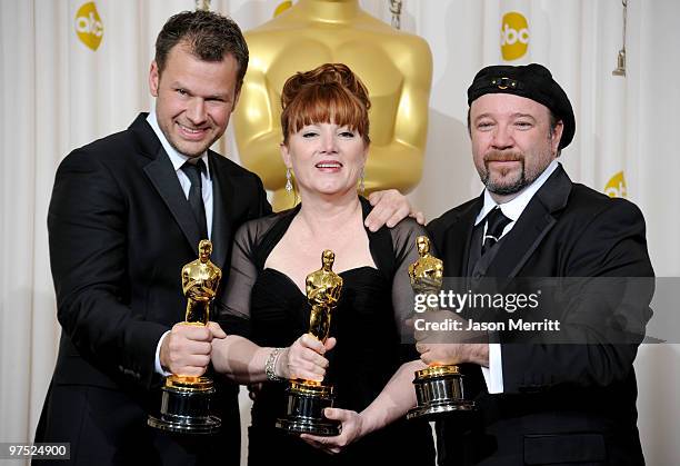 Makeup artists Joel Harlow, Mindy Hall and Barney Burman, winners of Best Makeup award for "Star Trek," pose in the press room at the 82nd Annual...