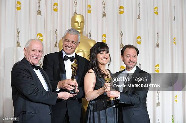 Best documentary feature winners Richard O'Barry , director Louie Psihoyos , producer Paula DuPre Pesman and actor Fisher Stevens from the film "The...