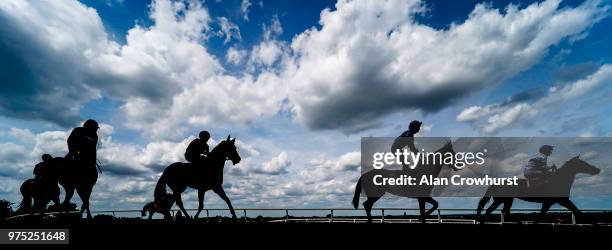 General view as runners ease down after finishing at Sandown Park Racecourse on June 15, 2018 in Esher, United Kingdom.