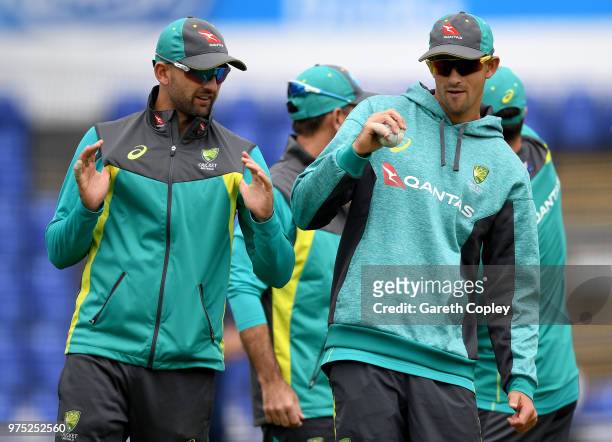 Nathan Lyon of Australia speaks with Ashton Agar during a nets session at SWALEC Stadium on June 15, 2018 in Cardiff, Wales.