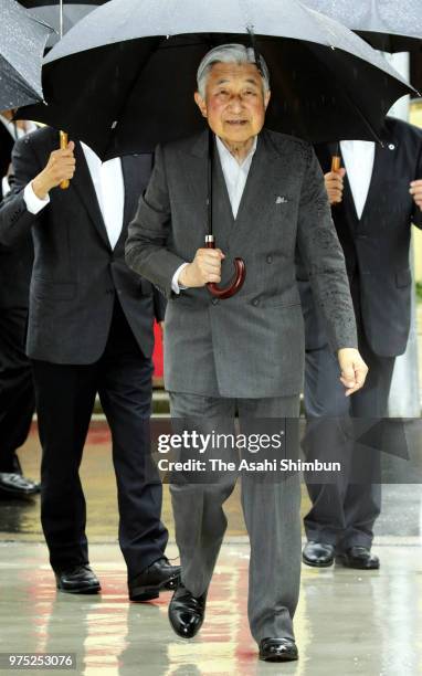 Emperor Akihito waves to well-wishers as he inspects a factory on June 15, 2018 in Tokyo, Japan.