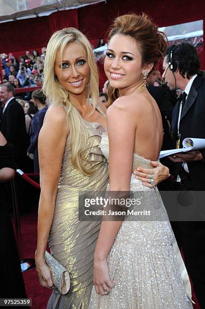 Singer Miley Cyrus and her mother Tish Cyrus arrive at the 82nd Annual Academy Awards held at Kodak Theatre on March 7, 2010 in Hollywood, California.