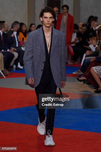 Model walks the runway at the Roberto Cavalli show during the 94th Pitti Immagine Uomo on June 13, 2018 in Florence, Italy.