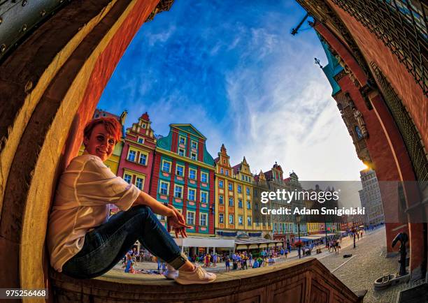 woman relaxing in a main square (hdri) - breslau stock pictures, royalty-free photos & images