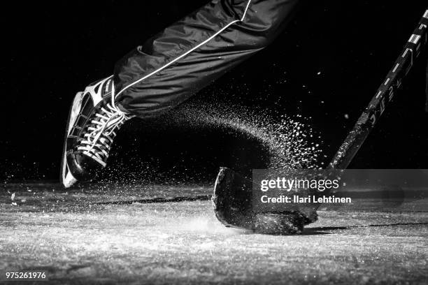 ice hockey - hockey player black background stock pictures, royalty-free photos & images