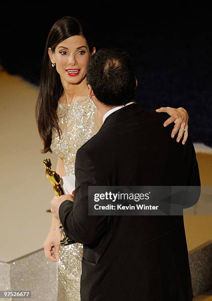 Cinematographer Mauro Fiore accepts Best Cinematography award for "Avatar" from presenter Sandra Bullock onstage during the 82nd Annual Academy...