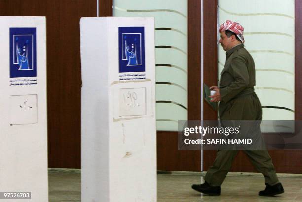 Kurdish regional president Massud Barzani heads to a voting booth at a polling station in the northern Iraqi Kurdish city of Arbil on March 7, 2010....