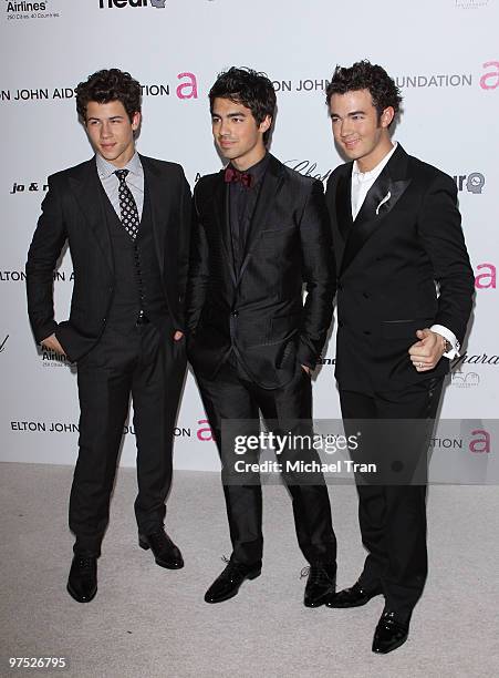 Nick Jonas, Joe Jonas and Kevin Jonas of the Jonas Brothers arrive to the 18th Annual Elton John AIDS Foundation Academy Awards Viewing Party held at...