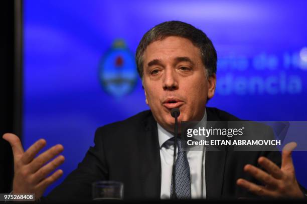 Argentina's Finance Minister Nicolas Dujovne gives a press conference at the Ministry in Buenos Aires, on June 15, 2018. - The Argentine central bank...
