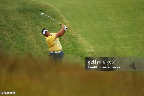 Kiradech Aphibarnrat of Thailand plays a shot on the tenth green during the second round of the 2018 U.S. Open at Shinnecock Hills Golf Club on June...