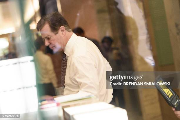 Paul Manafort goes through security as he arrives for a hearing at US District Court on June 15, 2018 in Washington, DC. Manafort faces charges...