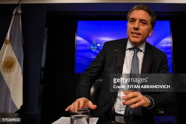 Argentina's Finance Minister Nicolas Dujovne arrives to give a press conference at the Ministry in Buenos Aires, on June 15, 2018. - The Argentine...