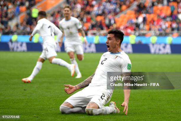 Jose of Uruguay slides on his knees as he celebrates after scoring his team's first goal during the 2018 FIFA World Cup Russia group A match between...