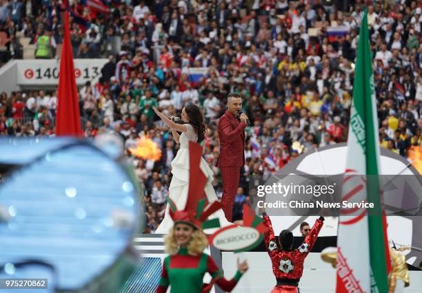 Robbie Williams and Aida Garifullina perform during the Opening Ceremony during the 2018 FIFA World Cup Russia group A match between Russia and Saudi...