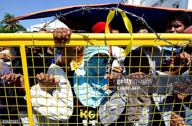 Supporters of unseated Bulacan Governor Joselito "Jonjon" Mendoza barricade Bulacan, north of Manila on March 8 to prevent newly installed governor...