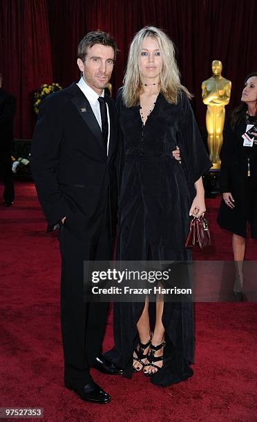 Actor Sharlto Copley and guest arrive at the 82nd Annual Academy Awards held at Kodak Theatre on March 7, 2010 in Hollywood, California.