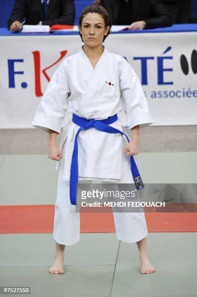 French deputy minister for Ecology and former Karate-kata French champion Chantal Jouanno gets ready to compete with her team in the French Karate...