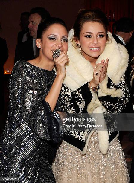 Nicole Richie and singer/actress Miley Cyrus attend the 18th Annual Elton John AIDS Foundation Academy Award Party at Pacific Design Center on March...