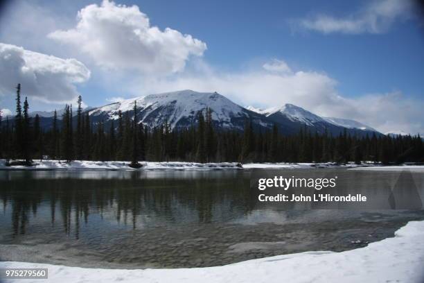 whistler mountain from athabasca river - athabasca river stock pictures, royalty-free photos & images